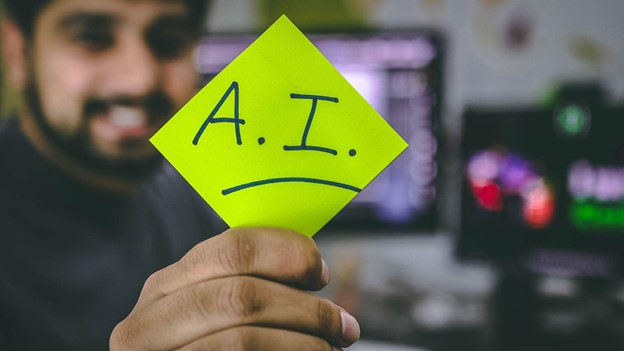 AI in web development - man holding paper