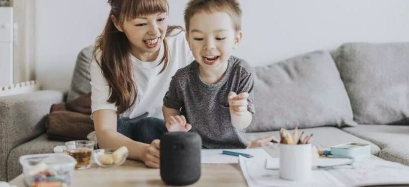 Two people playing with a virtual assistant or chatbot